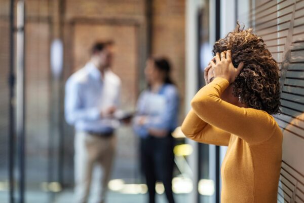 worker in corporate building stressed over conflict worker in corporate building stressed over conflict