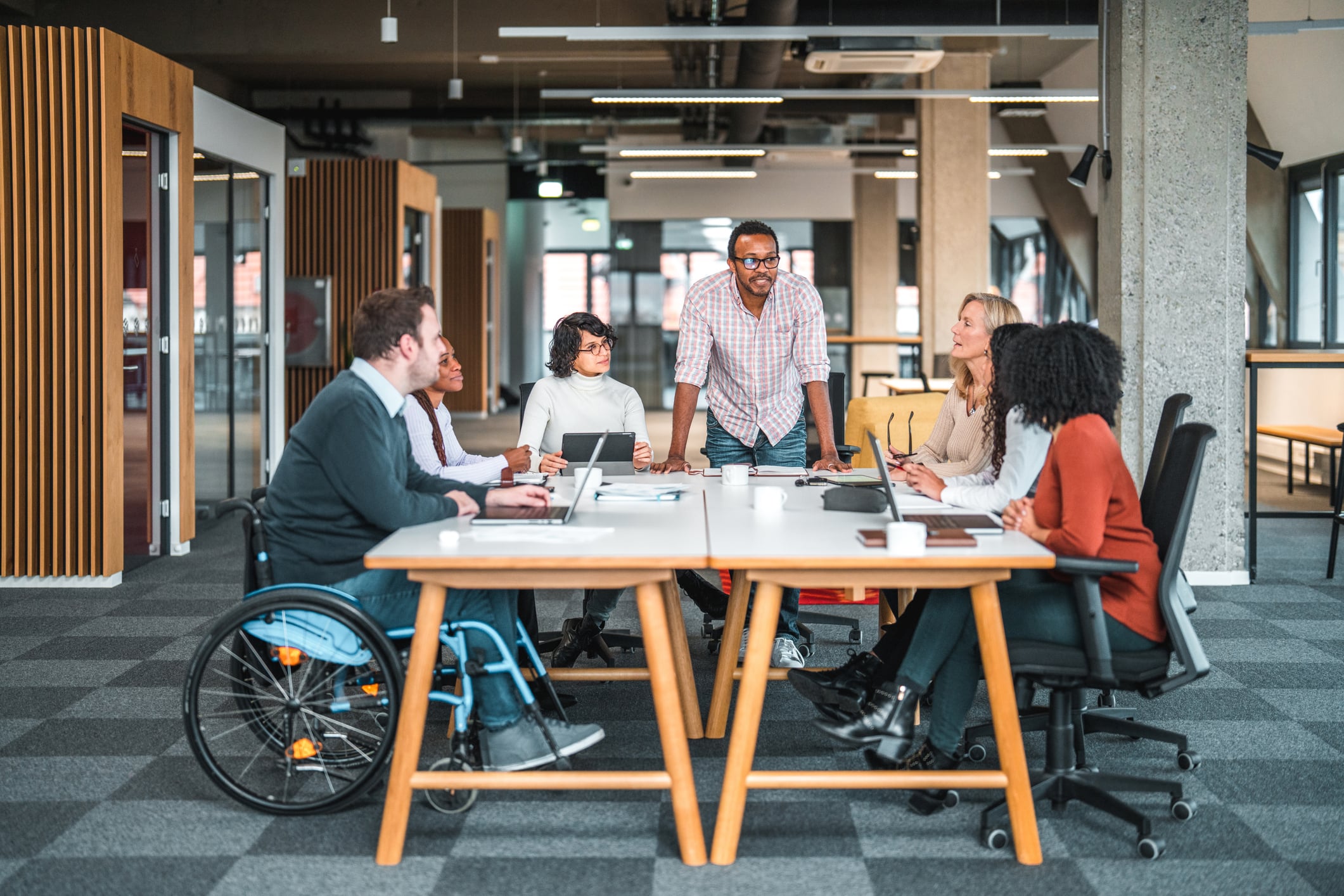 group of workers meeting around table group of workers meeting around table
