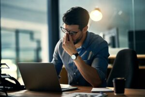 employee in business feeling burnt out